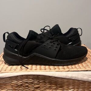 Nike black trainer shoes. Size 15. Signs of wear. Used. See photos.